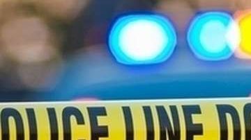 Escena del crimen acordonada por la Policía.