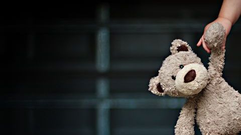 0_Low-section-of-a-girl-holding-her-teddy-bear