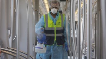 Personnel disinfect a wagon as a preventive measure against the coronavirus in Panama City, Panama, 21April 2020. Panamanian Metro installed thermal cameras to measure the temperature of passengers in one of its main stations and prohibited access to the facilities for those with fever as a measure to stop the expansion of COVID-19 in the country. EFE / Carlos Lemos