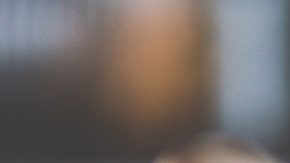 woman-with-brown-hair-doing-lipstick-and-holding-little-6393