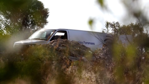 MEXICO-VIOLENCE-CRIME-MASS GRAVE
A vechicle of Jalisco's Forensic Institute is seen in the area where a clandestine mass grave was discovered at Lomas del Vergel in the community of Zapopan, Jalisco state, Mexico, on January 16, 2020. - Nearly 2,500 murders were reported between January and November in Jalisco -- a state hard-hit by violence linked to organized crime -- state authorities have said. (Photo by Ulises Ruiz / AFP) (Photo by ULISES RUIZ/AFP via Getty Images)