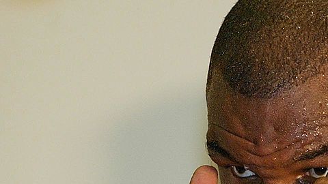 Mike Tyson tiene al tenista en su bicep izquierdo.