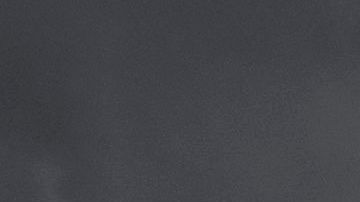 Autos de la Policía arden durante los disturbios en el oeste de L.A.