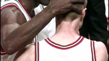 CHICAGO, UNITED STATES:  Chicago Bulls player Michael Jordan (L) congratulates teammate Steve Kerr after Kerr's last-second basket against the Utah Jazz in game six of the 1997 NBA Finals at the United Center in Chicago, IL.  The Bulls captured the NBA championship by defeating the Jazz 90-86.     (ELECTRONIC IMAGE)     AFP PHOTO/Robert SULLIVAN (Photo credit should read ROBERT SULLIVAN/AFP via Getty Images)