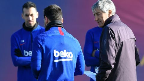 Lionel Messi y Quique Setién