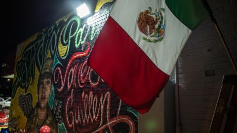 AUSTIN, TX - JULY 06: People pay respects at a mural of Vanessa Guillen, a soldier based at nearby Fort Hood on July 6, 2020 in Austin, Texas. A suspect in the disappearance of Guillen, whose remains were found in a shallow grave, faced a judge Monday morning.  (Photo by Sergio Flores/Getty Images)