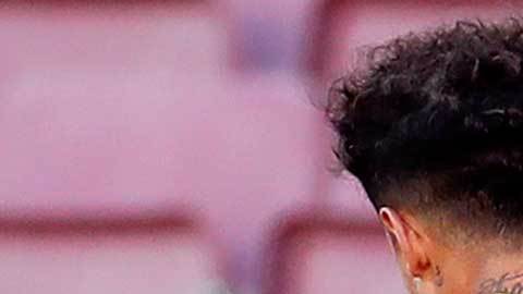 Antoine Griezmann celebra su gol con Phillipe Coutinho.