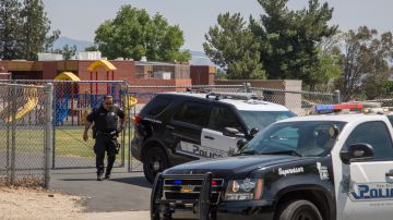 SAN BERNARDINO, CA - APRIL 10: Police officers stand guard at North Park Elementary School following a shooting on campus on April 10, 2017 in San Bernardino, California. Two people died, including the suspected shooter, and two children were wounded in the apparent murder-suicide attack. (Photo by David McNew/Getty Images)