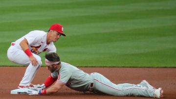 ST LOUIS, MO - APRIL 27:  Bryce Harper #3 of the Philadelphia Phillies slides safely into second base for a double against Tommy Edman #19 of the St. Louis Cardinals in the first inning at Busch Stadium on April 27, 2021 in St Louis, Missouri. (Photo by Dilip Vishwanat/Getty Images)