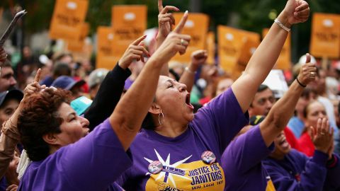 LOS ANGELES - OCTOBER 27: Janitors for Justice members Ana Castro (L) and Martina de Maroana (C) chant during a rally against Governor Arnold Schwarzenegger's special election initiatives October 27, 2005 in Los Angeles, California. The predominantly Latino crowd of union members oppose all of Schwarzenegger's initiatives to advance his reform agenda, which is at odds with unions of teachers, firefighters, police, and others. (Photo by David McNew/Getty Images)