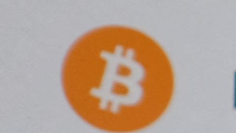 This illustration photo shows the Coinbase logo on a smartphone in Los Angeles on April 13, 2021. - The arrival April 13, 2021, of cryptocurrency exchange Coinbase on Nasdaq is one of the most anticipated events of the year on Wall Street, where enthusiasm for record-breaking bitcoin is in full swing, despite questions about the sustainability of the market. (Photo by Chris DELMAS / AFP) (Photo by CHRIS DELMAS/AFP via Getty Images)