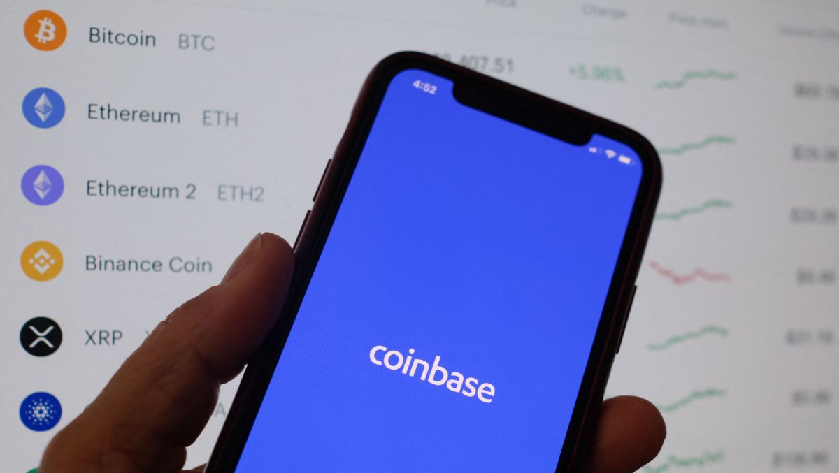 This illustration photo shows the Coinbase logo on a smartphone in Los Angeles on April 13, 2021. - The arrival April 13, 2021, of cryptocurrency exchange Coinbase on Nasdaq is one of the most anticipated events of the year on Wall Street, where enthusiasm for record-breaking bitcoin is in full swing, despite questions about the sustainability of the market. (Photo by Chris DELMAS / AFP) (Photo by CHRIS DELMAS/AFP via Getty Images)