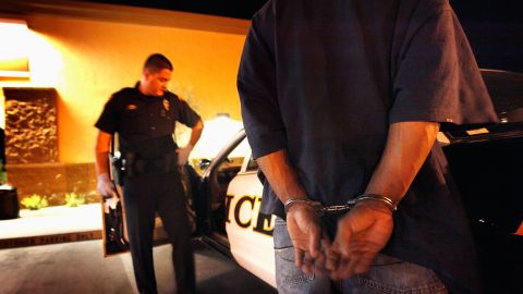 TUCSON, AZ - MAY 29: Tucson Police Officer Angel Ramirez arrests a man for trespassing May 29, 2010 in Tucson, Arizona. Ramirez works in the city's predominately Hispanic south side. The Tucson Police Department is currently gearing up to begin training its officers on the implementation of the controversial new immigration law SB 1070. Although a Tucson police officer was one of the first to file suit in federal court challenging the new law, most rank and file officers tend to support the legislation while the Arizona Chiefs of Police have criticized it. (Photo by Scott Olson/Getty Images)