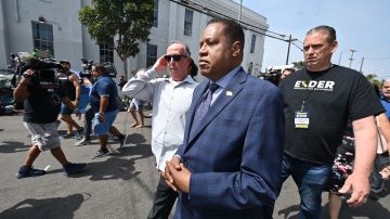 Conservative talk show host and gubernatorial recall candidate Larry Elder (C) walks along streets lined with tents of unhoused people, in the Venice neighborhood of Los Angeles, California, September 8, 2021 ahead of the special recall election. - The recall election, which will be held on September 14, 2021, asks voters to respond two questions: whether Governor Gavin Newsom, a Democratic, should be recalled from the office of governor, and who should succeed Newsom if he is recalled. Forty-six candidates, including nine Democrats and 24 Republicans, are looking to take Newsom's place as the governmental leader of California. (Photo by Robyn Beck / AFP) (Photo by ROBYN BECK/AFP via Getty Images)
