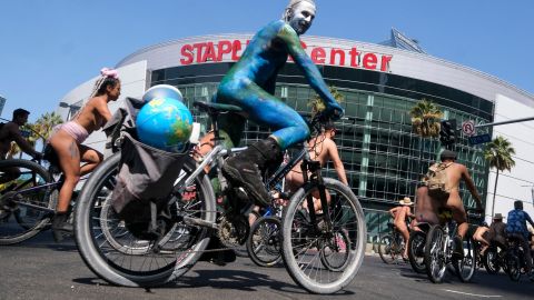 EDITORS NOTE: Graphic content / Nude cyclists ride down the streets during the World Naked Bike Ride on September 18, 2021 in downtown Los Angeles. (Photo by RINGO CHIU / AFP) (Photo by RINGO CHIU/AFP via Getty Images)