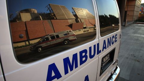 LOS ANGELES, CA - OCTOBER 09: An ambulance transporting a patient is reflected in the window of another ambulance at Ronald Reagan UCLA Medical Center on October 9, 2008 in Los Angeles, California. California State Treasurer Bill Lockyer has warned that California cash revenues will run out by the end of the month affecting law enforcement agencies, nursing homes and other services and government entities of approximately 5,000 California cities, counties, and school districts. A worldwide credit crunch threatens to derail state plans for a routine 7 billion dollar loan to even out the tax flow into the state treasury. Just two weeks after state lawmakers came to agreement, after months of haggling on a record-overdue state budget, California Gov. Arnold Schwarzenegger is warning of future cuts to the state budget to deal with skyrocketing financial problems. A frozen credit market and revenues for the first quarter of the fiscal year that fell more than a billion dollars short of previous projections are causing the governor and state legislative leaders scrabbling to deal with a new budget mess. (Photo by David McNew/Getty Images)