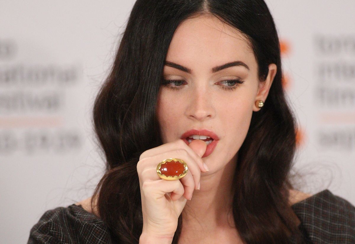 Megan Fox sets the nets on fire by posing in a thong and blouse with transparencies
