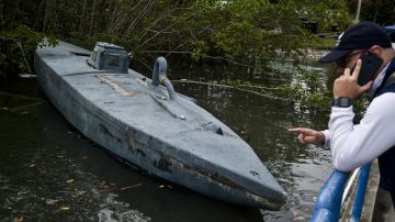 View of a homemade submersible watercraft confiscated to drug traffickers at the dock of a military base on the Pacific Ocean in the municipality of Tumaco, department of Narino, in the southwest of Colombia, on November 8, 2018. - Drug trafficking does not give in to the military offensive in Colombia, and now Mexicans supervise in person the shipments to the US. According to the DEA, 84% of the cocaine that entered in 2017 the US -the largest consumer of the drug-, did it through the Pacific. (Photo by LUIS ROBAYO / AFP)        (Photo credit should read LUIS ROBAYO/AFP via Getty Images)