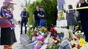 TOPSHOT - Mourners and well wishers leave flowers at a make-shift memorial acroos the street from the Chabad of Poway Synagogue on Sunday, April 28, 2019 in Poway, California, one day after a teenage gunman opened fire, killing one person and injuring three others including the rabbi as worshippers marked the final day of Passover, authorities said. - The shooting in the town of Poway, north of San Diego, came exactly six months after a white supremacist killed 11 people at Pittsburgh's Tree of Life synagogue -- the deadliest attack on the Jewish community in US history. (Photo by SANDY HUFFAKER / AFP) (Photo credit should read SANDY HUFFAKER/AFP via Getty Images)