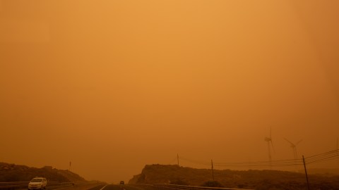 Cars drive on the TF-1 highway during a sandstorm in Santa Cruz de Tenerife, on the Canary Island of Tenerife, on February 23, 2020. - Airports on Spain's Canary Islands were closed after strong winds carrying red sand from the Sahara shrouded the tourist hotspot. (Photo by DESIREE MARTIN / AFP) (Photo by DESIREE MARTIN/AFP via Getty Images)