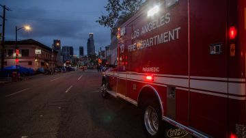 An ambulance of the LAFD Station No9 rides along Skid Row on April 12, 2020 in downtown Los Angeles, California. - One of the busiest fire station in the country , LA Fire Station 9 is on the front lines of California's homeless crisis e Coronavirus pandemic. (Photo by Apu GOMES / AFP) (Photo by APU GOMES/AFP via Getty Images)