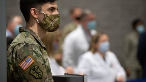 A member of the National Guard attends a press conference at a temporary field hospital at the Walter E. Convention Center in Washington, DC on May 11, 2020, featuring 437 beds for patients suffering from coronavirus, COVID-19, and part of the city's medical surge response plan as an alternate care site to assist hospitals. (Photo by SAUL LOEB / AFP) (Photo by SAUL LOEB/AFP via Getty Images)