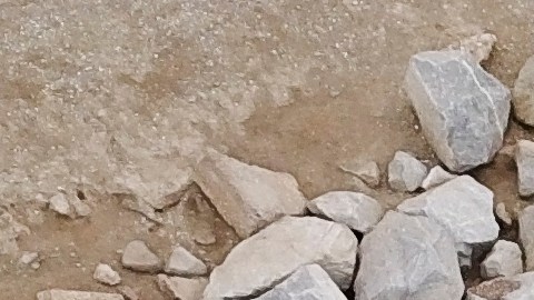TOPSHOT - This aerial picture taken on October 4, 2021 shows environmental response crews cleaning up oil that flowed near the Talbert marsh and Santa Ana River mouth, creating a sheen on the water after an oil spill in the Pacific Ocean in Huntington Beach, California. (Photo by Patrick T. FALLON / AFP) (Photo by PATRICK T. FALLON/AFP via Getty Images)