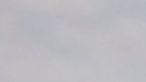 An oil platform and cargo container ships are seen on the horizon as environmental response crews clean the beach after an oil spill in the Pacific Ocean in Huntington Beach, California on October 4, 2021. (Photo by Patrick T. FALLON / AFP) (Photo by PATRICK T. FALLON/AFP via Getty Images)