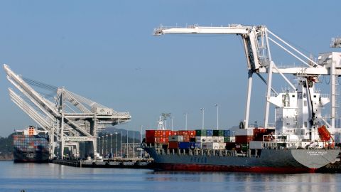 OAKLAND, CA - OCTOBER 1: Loaded cargo ships sit idle at the Port of Oakland October 1, 2002 in Oakland, California. West coast ports remain closed as talks between longshoremen unions and shipping companies continue. (Photo by Justin Sullivan/Getty Images)