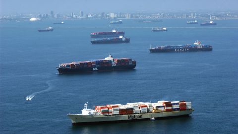 LONG BEACH, CA - OCTOBER 2: Container ships remain anchored outside of the ports of Los Angeles and Long Beach October 2, 2002 in Long Beach, California. The ships are among the 70 loaded vessels in Long Beach, seen on the horizon, that cannot bring goods through Los Angeles because of the West Coast lockout of dockworkers by shipping lines. Thirty-one more ships are scheduled to arrive in the coming days to this, the world's third-largest harbor complex. Hopes that federal mediation would resolve the impasse, which is costing an estimated $1 billion a day, were dashed October 1 after union representatives stormed out of a meeting after shippers showed up with armed security guards. (Photo by David McNew/Getty Images)