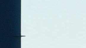 LOS ANGELES, CA - OCTOBER 9: A trucker polishes his rig while waiting near ships and cranes for the re-opening of the Port of Los Angeles on October 9, 2002 in Los Angeles, California. President George W. Bush used a court order to force the opening of West Coast ports tonight, ending an estimated $1 billion-per-day loss to the United States economy. (Photo by David McNew/Getty Images)