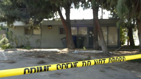 FRESNO, CA - MARCH 17: Crime scene tape stretches across the front of the house where accused killer Marcus Wesson lived March 17, 2004 in Fresno, California. Wesson is accused of shooting nine family members at his home last week. He could face the death penalty if convicted. (Photo by Roger Hornback/Getty Images)