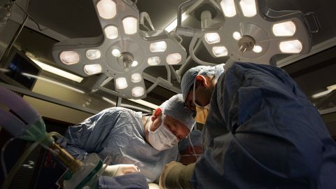 BIRMINGHAM, UNITED KINGDOM - JUNE 09: Consultant Surgeon Andrew Ready and his team conducts] a live donor kidney transplant at The Queen Elizabeth Hospital Birmingham on June 9, 2006, in Birmingham, England. Kidney failure patient Carol Playfair was given the chance of life when her sister Tracey Playfair offered one of her own perfect kidneys to help save the life of Carol. The operation at The QE Hospital, part of The University Hospital's Trust was one of 1500 live donor transplants carried out in the United Kingdon every year. Despite the introduction of Donor Cards, there are still too few kidneys available to help all those who require a transplant, thereby producing a waiting list and the only chance of survival is by live donor. (Photo by Christopher Furlong/Getty Images)