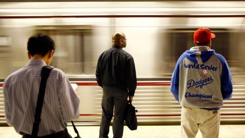 LOS ANGELES, CA - JUNE 3: Passengers wait for Metro Rail subway trains during rush hour June 3, 2008 in Los Angeles, California. Skyrocketing gas prices are driving more commuters to take trains and buses to work instead of their cars. In the first three months of 2008, the number of trips taken on public transport in the US rose 3 percent to 2.6 billion, creating pressures on some transportation systems to cope with increasing ridership. Transit officials in southern California and elsewhere are now encouraging employers to stagger employee schedules to ease the rush hour crunch on trains and buses and Metrolink plans to add 107 rail cars to its fleet of 155 as soon as next year. (Photo by David McNew/Getty Images)