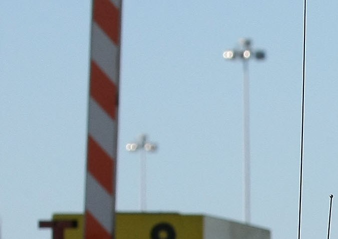 OAKLAND, CA - OCTOBER 28: California Highway Patrol officer Rick Baller stands next to his car as he guards the closed toll plaza leading to the San Francisco Bay Bridge October 28, 2009 in Oakland, California. The San Francisco Bay Bridge was abruptly closed Tuesday evening after two steel tie rods and a crossbeam from a steel saddle broke and fell onto the upper deck of the bridge landing on three vehicles and causing one person to suffer injuries. The eastern span of the bridge is undergoing seismic renovation and is expect to be completed in 2013. (Photo by Justin Sullivan/Getty Images)