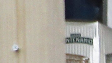 LOS ANGELES, CALIFORNIA - APRIL 04: Cashiers wear face masks as they stand behind newly installed plexiglass barriers for protection in a liquor store amid the coronavirus pandemic on April 4, 2020 in Los Angeles, California. The U.S. COVID-19 death toll has now surpassed 8,000. (Photo by Mario Tama/Getty Images)