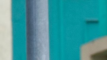 A black vehicle covered with stickers is cornered by police cars at the corner of Fairfax Avenue and Sunset Boulevard where a body covered in a white sheet lies next to it in Los Angeles on April 24, 2021 in what appears to be an officer-involved shooting. - On the evening of the shooting the LAPD official twitter account read: There has been an Officer-Involved Shooting on Sunset Blvd. near Fairfax in Hollywood Division. Around 2:35 p.m. officers were heading to a radio call with their lights and sirens on when a car pulled in front of them, stopped suddenly and reversed into the police car. The driver of the car exited, was wearing body armor, and had his right hand concealed behind him. He moved toward the officers who had exited their patrol car. He counted "3, 2, 1" and began to move his arm to the front of his body, at which time there was an officer involved shooting. The man was struck by gunfire and pronounced deceased at scene. Force Investigation Division detectives are on scene conducting interviews and gathering evidence.The man who was shot and killed by the Los Angeles Police Department has been identified as 34-year-old Richard Solitro. (Photo by VALERIE MACON / AFP) (Photo by VALERIE MACON/AFP via Getty Images)