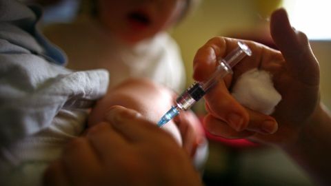 GLASGOW, UNITED KINGDOM - SEPTEMBER 03: A young boy receives a immunization jab at a health centre in Glasgow September 3, 2007 in Glasgow, Scotland. Medical experts still believe the MMR jab is safe and that the vaccine does not cause autism. (Photo by Jeff J Mitchell/Getty Images)