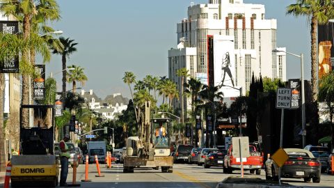 WEST HOLLYWOOD, CA - JANUARY 28: An excavator slows dowen the traffic in the construction zone of Sunset Boulevard, also known as "The Sunset Strip," where work has began on the $7 million facelift after more than 75 years of use on January 28, 2010 in West Hollywood, California. The City of West Hollywood received one million dollars in federal funds from the Federal American Reinvestment and Recovery Act for the Sunset Strip Beautification Project. (Photo by Kevork Djansezian/Getty Images)