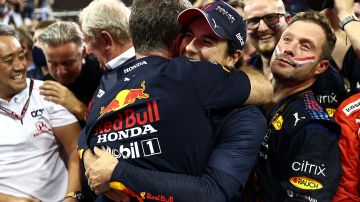 ABU DHABI, UNITED ARAB EMIRATES - DECEMBER 12: Sergio Perez of Mexico and Red Bull Racing celebrates with Red Bull Racing Team Principal Christian Horner in parc ferme during the F1 Grand Prix of Abu Dhabi at Yas Marina Circuit on December 12, 2021 in Abu Dhabi, United Arab Emirates. (Photo by Mark Thompson/Getty Images)