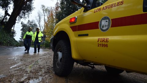 Heavy equipment is used by the Los Angeles Fire Department to clear a mudflow in a residential area north of Hollywood in Los Angeles, California January 17, 2019. - Heavy rain and danger of flooding and mudslides is continuing in Los Angeles and across Southern California as storms wallops the region. (Photo by Robyn Beck / AFP) (Photo credit should read ROBYN BECK/AFP via Getty Images)