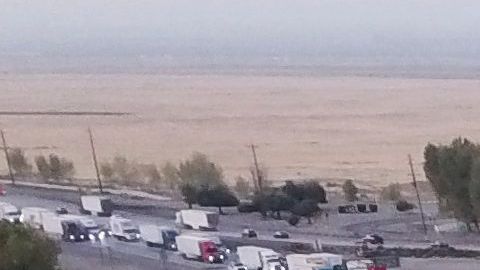 An aerial picture taken on August 26, 2021, shows trucks, cars, and other vehicles sitting in traffic due to road construction on Interstate 5 as they transit through the Tejon Pass from the Grapevine in Kern County, California . - Biden and his Democratic allies controlling the chamber are pushing for passage of both a $1.2 trillion overhaul to the country's infrastructure and a bill costing $3.5 trillion over 10 years that would pay for improvements to education, health care and climate change resiliency. (Photo by Patrick T. FALLON / AFP) (Photo by PATRICK T. FALLON/AFP via Getty Images)