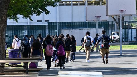 Students walk to their classrooms at a public middle school in Los Angeles, California, September 10, 2021. - Children aged 12 or over who attend public schools in Los Angeles will have to be fully vaccinated against Covid-19 by the start of next year, city education chiefs said September 9, 2021, the first such requirement by a major education board in the United States. (Photo by Robyn Beck / AFP) (Photo by ROBYN BECK/AFP via Getty Images)