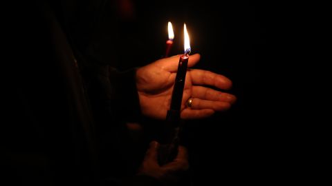 LEIGH-ON-SEA, ENGLAND - OCTOBER 16: Members of the public light candles in memory of MP Sir David Amess at Belfairs Sports Ground on October 16, 2021 in Leigh-on-Sea, United Kingdom. Counter-terrorism officers are investigating the murder of Sir David Amess, the Conservative MP for Southend West, who was stabbed to death during his constituency surgery yesterday around midday. A man in his twenties was arrested at the scene. (Photo by Hollie Adams/Getty Images)