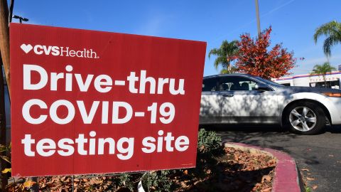 A driver passes a Covid-19 drive-thru testing site in Alhambra, California on December 20, 2021. - The Los Angeles County Department of Public Health reported over 3,500 new Covid-19 cases on December 19. (Photo by Frederic J. BROWN / AFP) (Photo by FREDERIC J. BROWN/AFP via Getty Images)