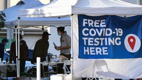 People wait in line for a free Covid-19 test in Los Angeles, California on December 21, 2021. - Days out from Christmas, Americans are facing long lines to get tested for the coronavirus amid a new surge driven by the Omicron variant and a dire shortage of options for this vital screening measure. (Photo by Frederic J. BROWN / AFP) (Photo by FREDERIC J. BROWN/AFP via Getty Images)