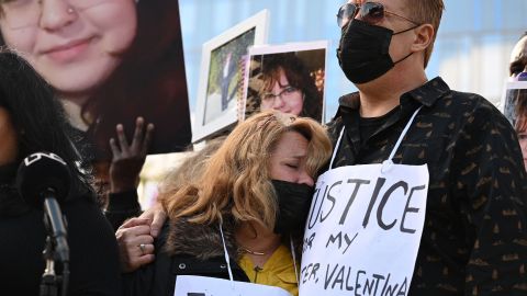 Soledad Peralta and Juan Pablo Orellana Larenas (R), parents of 14-year old Valentina Orellana-Peralta, who was killed by a stray police bullet last week while shopping at a clothing store, attend at a press conference outside Los Angeles Police Department headquarters in Los Angeles, California, December 28, 2021. (Photo by Robyn Beck / AFP) (Photo by ROBYN BECK/AFP via Getty Images)