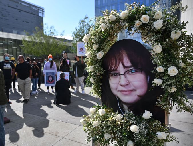A photo of 14-year old Valentina Orellana-Peralta, who was killed by a stray police bullet last week while shopping at a clothing store, is seen at a press conference outside Los Angeles Police Department headquarters in Los Angeles, California, December 28, 2021. (Photo by Robyn Beck / AFP) (Photo by ROBYN BECK/AFP via Getty Images)
