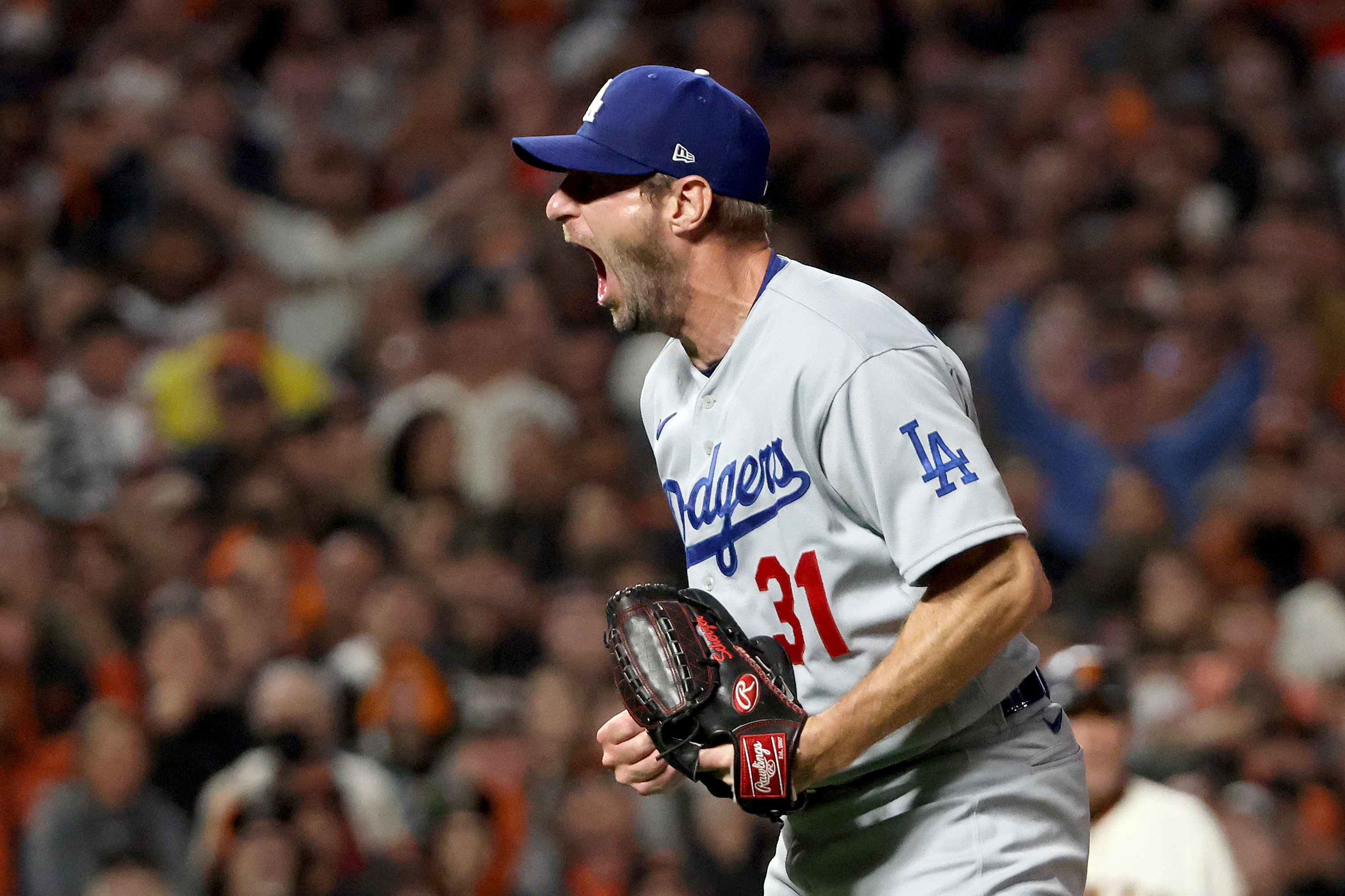 SAN FRANCISCO, CALIFORNIA - OCTOBER 14: Max Scherzer #31 of the Los Angeles Dodgers celebrates after beating the San Francisco Giants 2-1 in game 5 of the National League Division Series at Oracle Park on October 14, 2021 in San Francisco, California. (Photo by Harry How/Getty Images)
