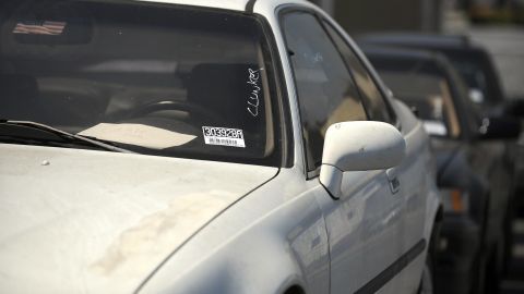 An old car is parked at a Toyota car dealer, who offers the "Cash for Clunkers" program to his clients in Culver City, California, on August 7, 2009. The hugely popular "Cash for Clunkers" program aimed at boosting auto sales has the potential to rev up economic activity even though many analysts say the lift will be short-lived. The "clunkers" plan offers owners of aging cars and trucks incentives up to 4,500 dollars toward a new, more-efficient vehicle, a scheme meant to help boost the struggling auto industry while helping the environment. The plan is modeled on similar programs in France, Germany, Italy and Spain, which have had success, although some US critics argue it add to government debt and merely speed up sales that would have occurred anyway. AFP PHOTO / GABRIEL BOUYS (Photo credit should read GABRIEL BOUYS/AFP via Getty Images)